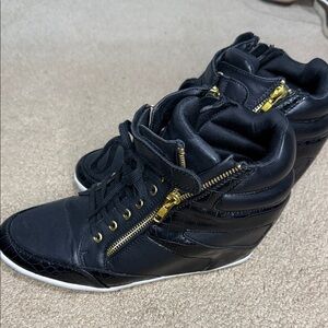 Stylish Black High-Top Sneakers with Gold Accents